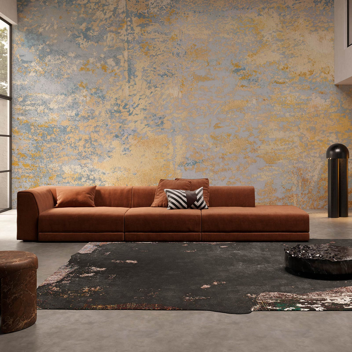 Wall adorned with Vintage Pastel Abstract Mural Wallpaper, blue and gold tones, brown sofa, contemporary setting.