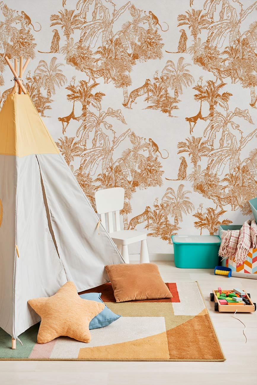 Vintage Jungle Scene Wallpaper with teepee, cushions, light wooden floor, in playroom setting. Rustic charm.