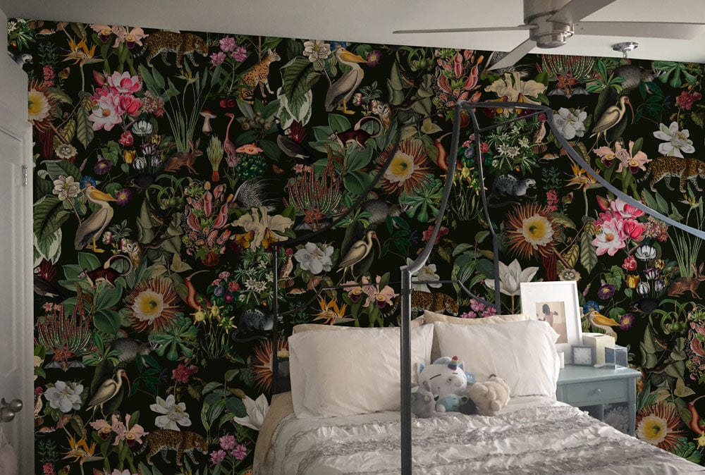 Tropical Jungle Paradise mural in bedroom with bed, ceiling fan, and vibrant floral wallpaper design.