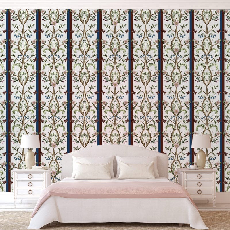 Elegant vintage floral wallpaper, blue and beige accents; bedroom decor with white bed, wooden flooring.