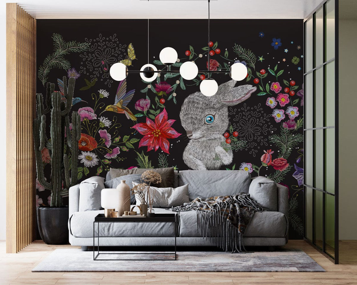 Enchanted Woodland Animals Floral Mural, dark forest wallpaper behind grey sofa, modern living room decor.