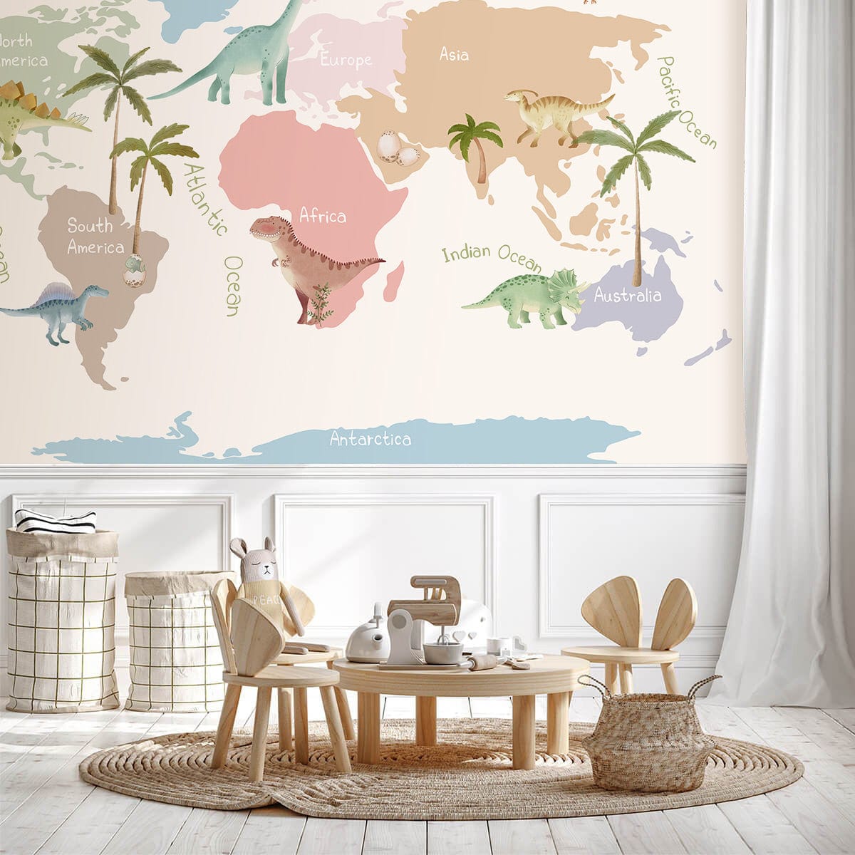 Colourful dinosaur world map mural wallpaper in children's room with wooden furniture and cosy decor.
