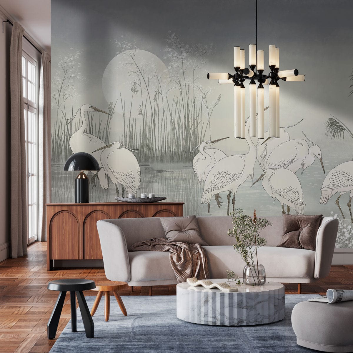Tranquil Heron Watercolour Mural Wallpaper in stylish living room with grey sofa, wooden floor, chandelier.
