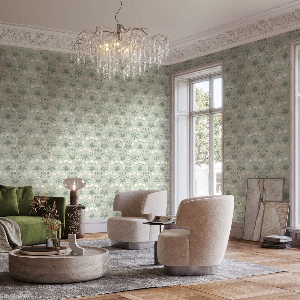 Vintage floral wallpaper in soft green tones, elegant living room, plush beige chairs, hardwood flooring.