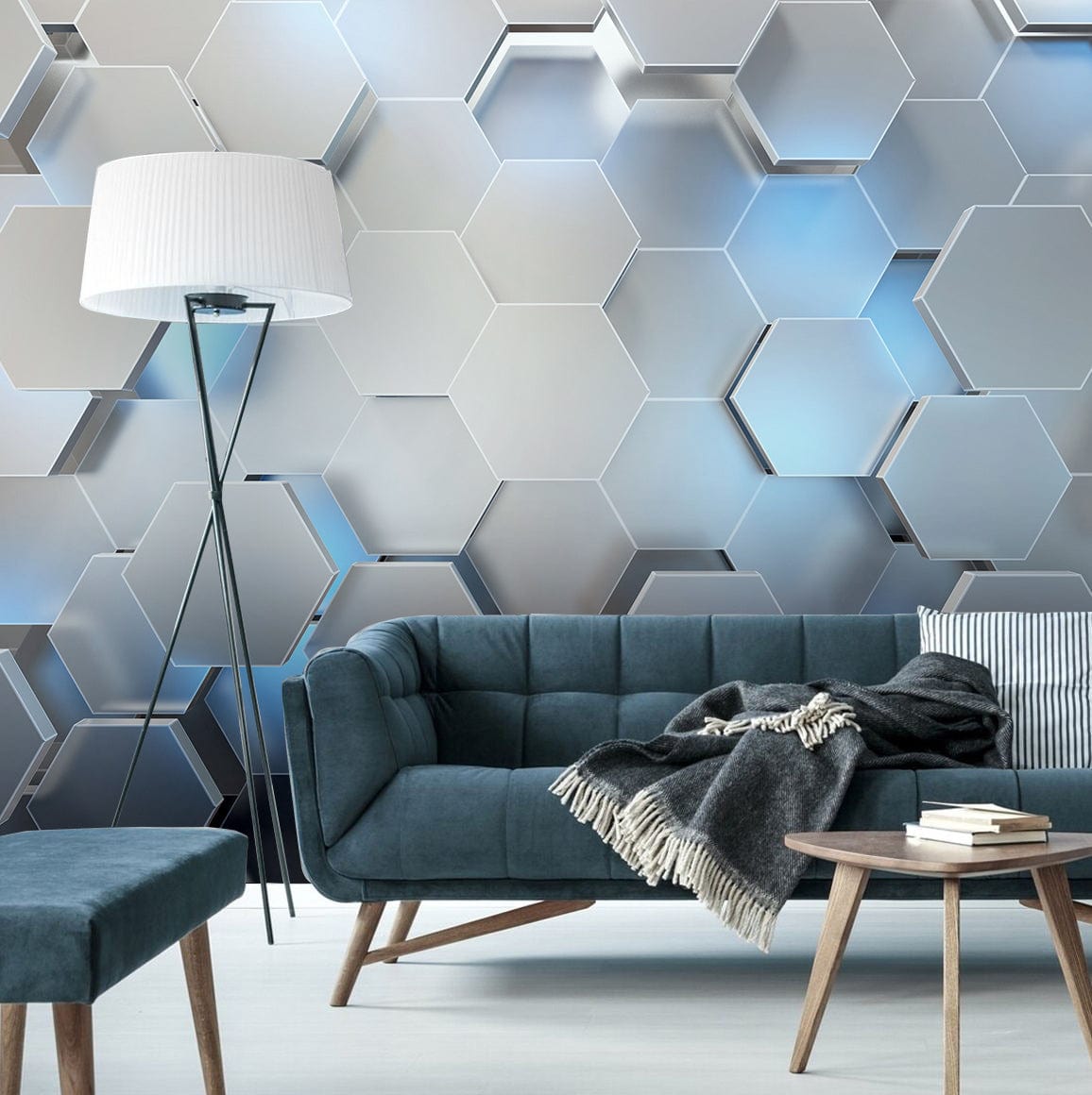 Modern geometric wallpaper with silver-blue 3D effect, dark blue sofa, floor lamp, modern living room.