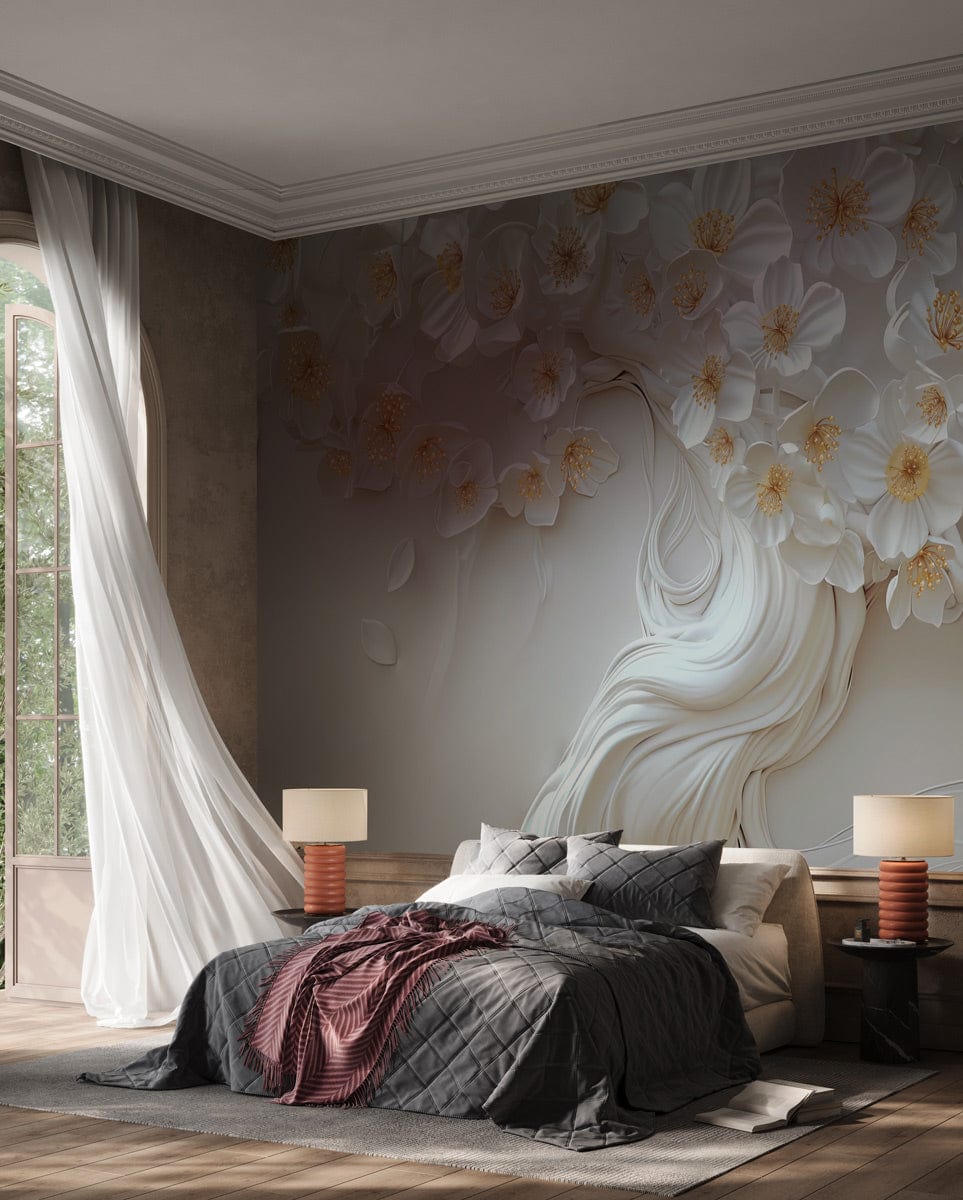 Elegant white floral 3D mural wallpaper in luxurious bedroom with grey quilted bedding and wooden flooring.