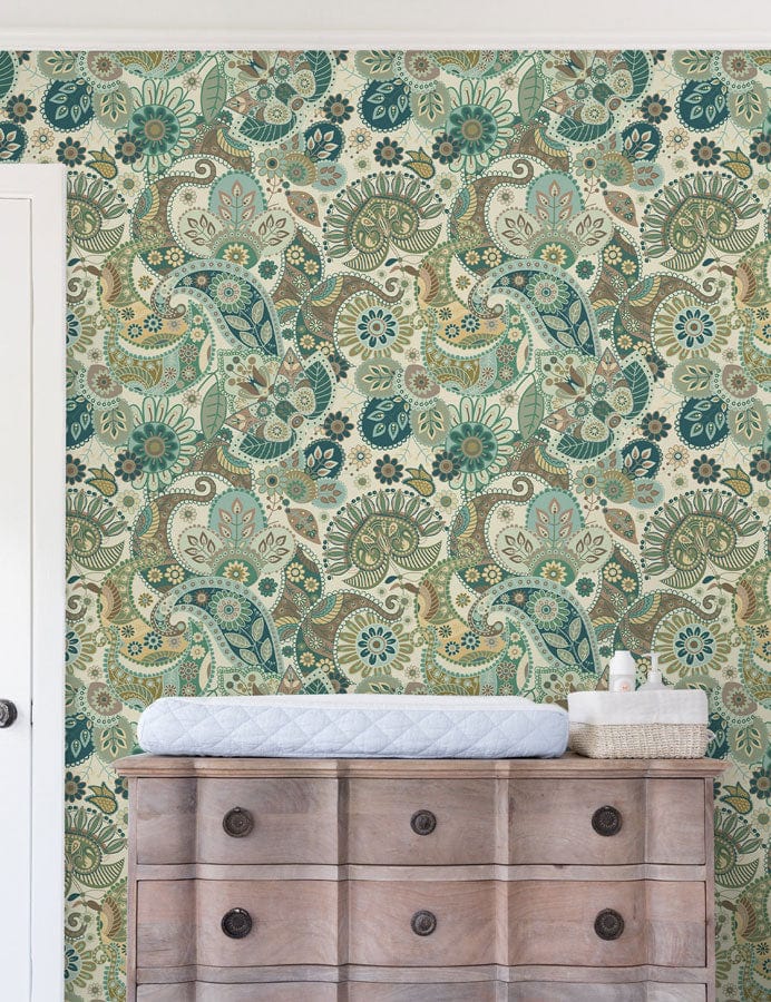 Vintage Paisley Elegance wallpaper with teal and beige pattern; wooden chest, nursery setting.