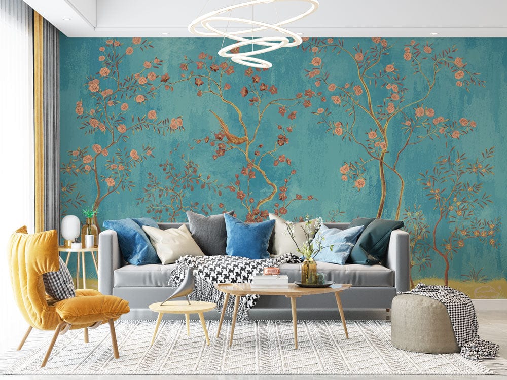 Elegant turquoise floral mural wallpaper, birds, pink blossoms, grey sofa, mustard armchair, living room.
