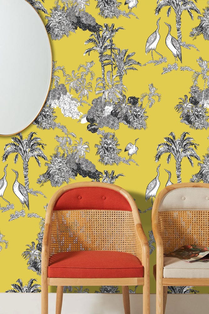 Golden Tropical Oasis Toile Style Wallpaper with cane chairs, yellow and grey design, elegant decor.