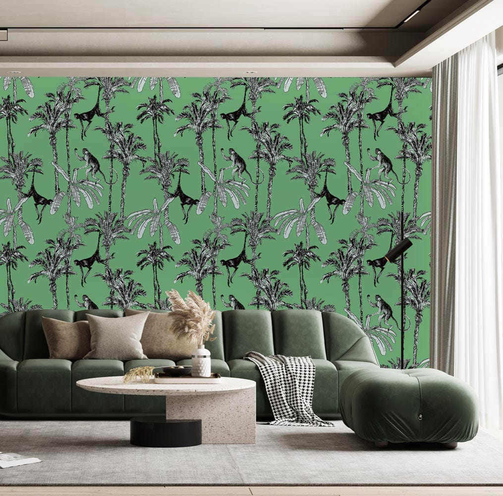 Tropical Jungle Art Deco wallpaper with monkeys, green palms. Green sofa, round table in living room.