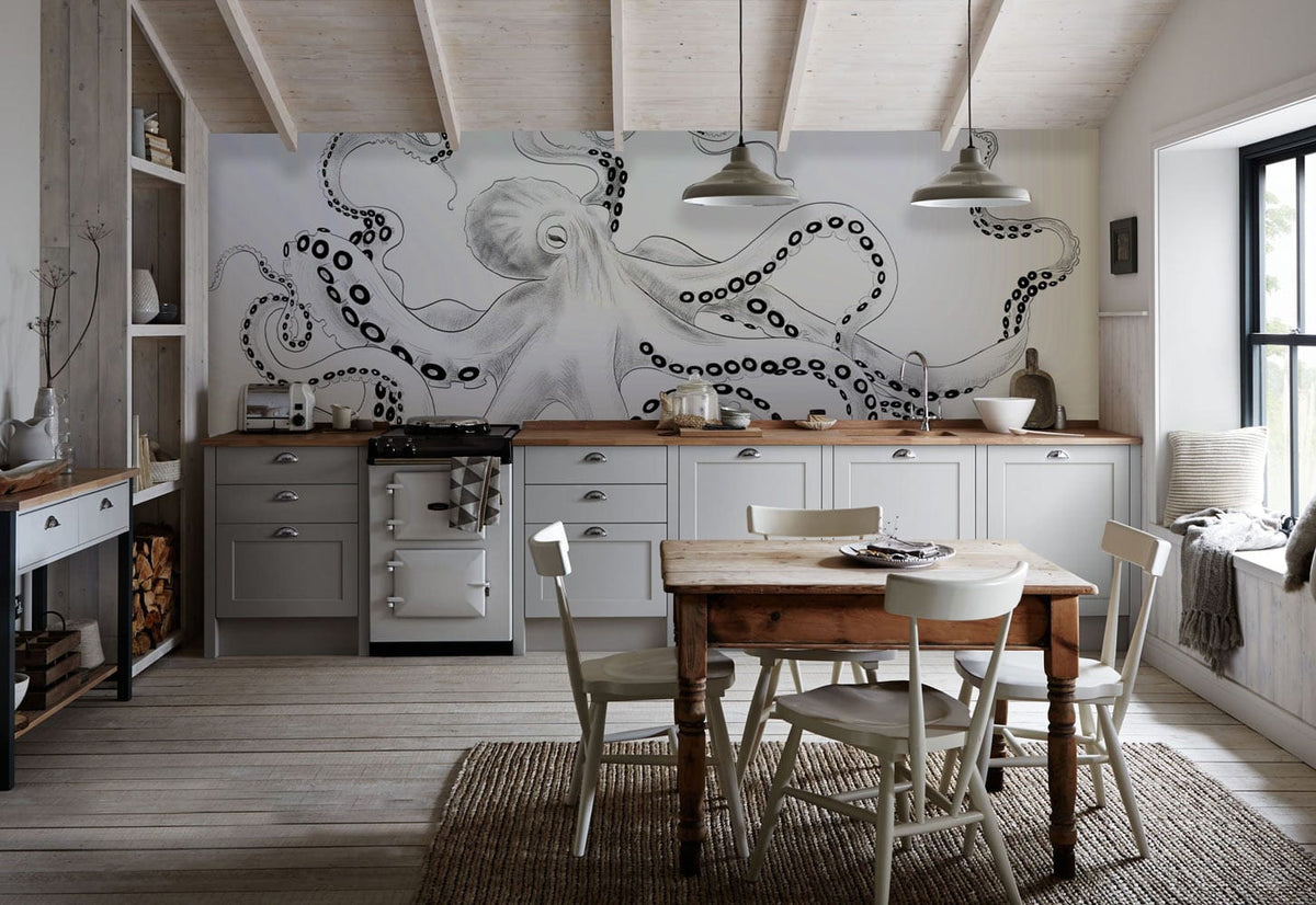 Monochrome Ink Octopus Mural Wallpaper in contemporary kitchen with rustic dining set and grey cabinets.