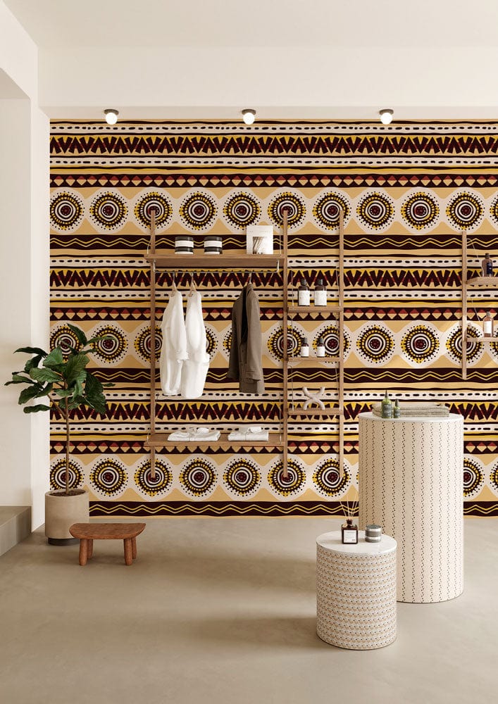 Tribal Geometric Brown and Cream Ethnic Patterned Wallpaper Mural with shelving, concrete flooring, plant.