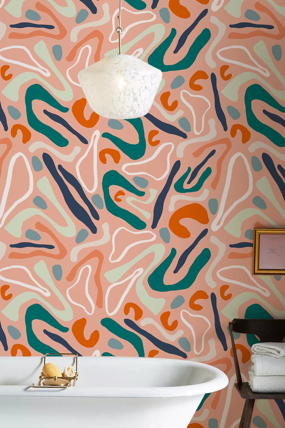 Modern art patterned wallpaper design with abstract terracotta and teal in a stylish bathroom setting.