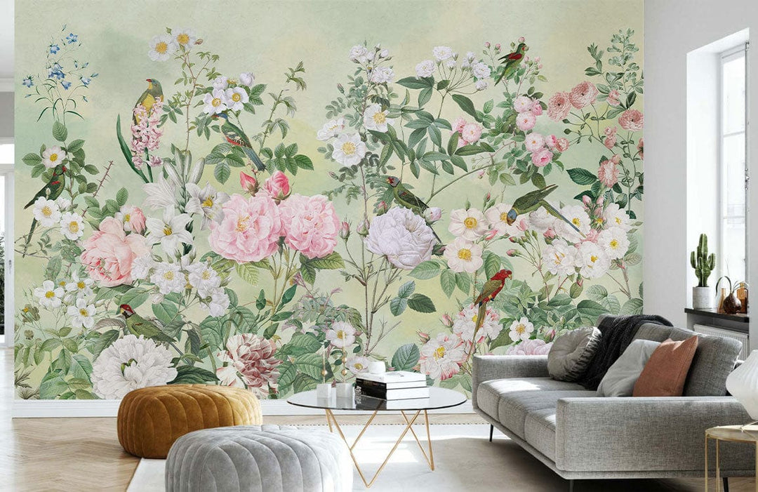 Elegant pastel floral wallpaper with birds; grey sofa, modern coffee table, ottoman in living room.