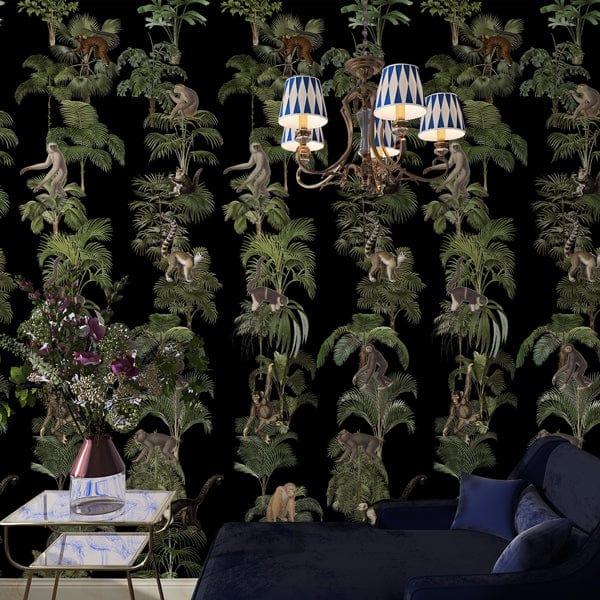 Tropical Jungle Safari Monkeys wallpaper with chandelier, dark sofa, marble side table, floral decor.