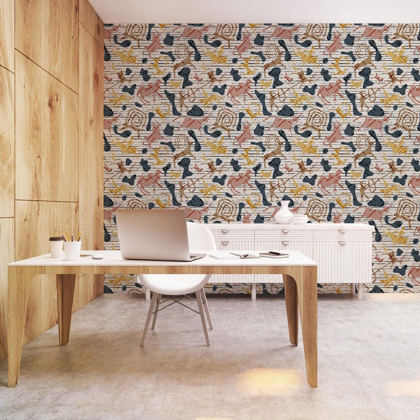 Abstract geometric multi-coloured wallpaper in modern office with wood accents and minimalist white furniture.