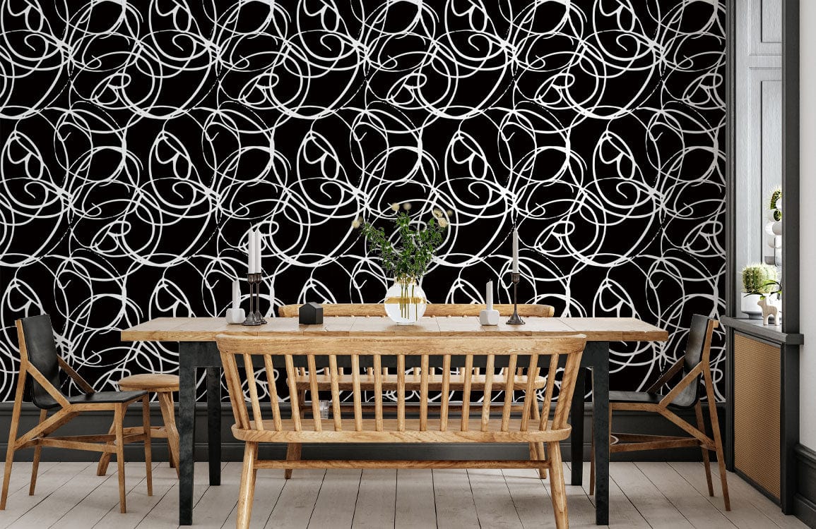 Intricate Art Nouveau floral wallpaper, black-and-white pattern, dining room, wooden table, chairs, light flooring.