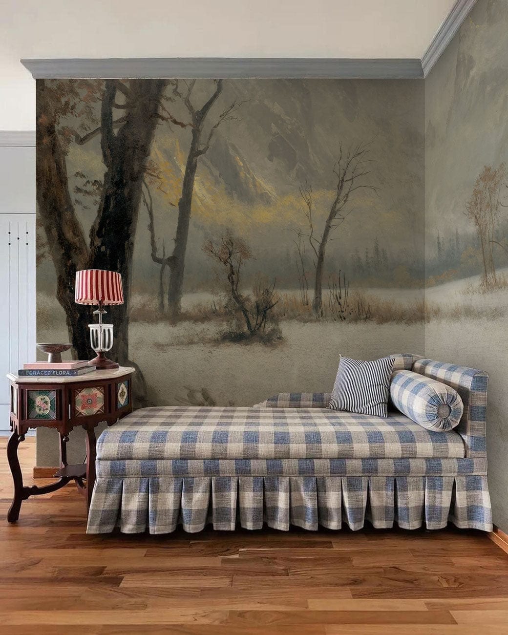 Misty Mountain mural wallpaper, grey tones; checkered sofa; hardwood flooring; serene corner room ambiance.
