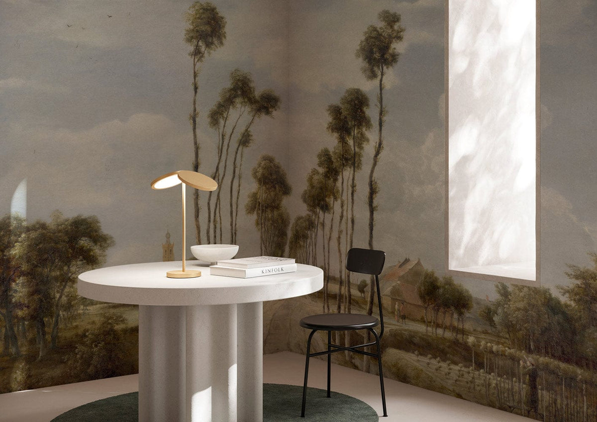 Vintage Countryside Landscape mural in earthy tones, featured in a room with modern round table and chair.
