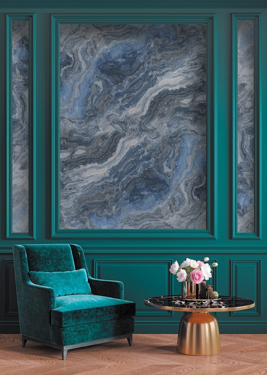 Elegant wallpaper mural in blue-grey marble design with teal armchair, gold table, and wooden floor.