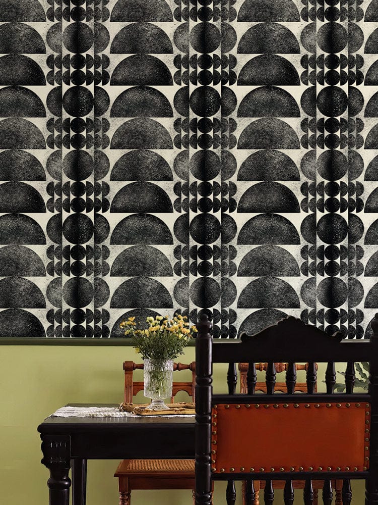 Monochrome Art Deco patterned wallpaper, elegant dining room, vintage wooden chair, black table, floral vase.