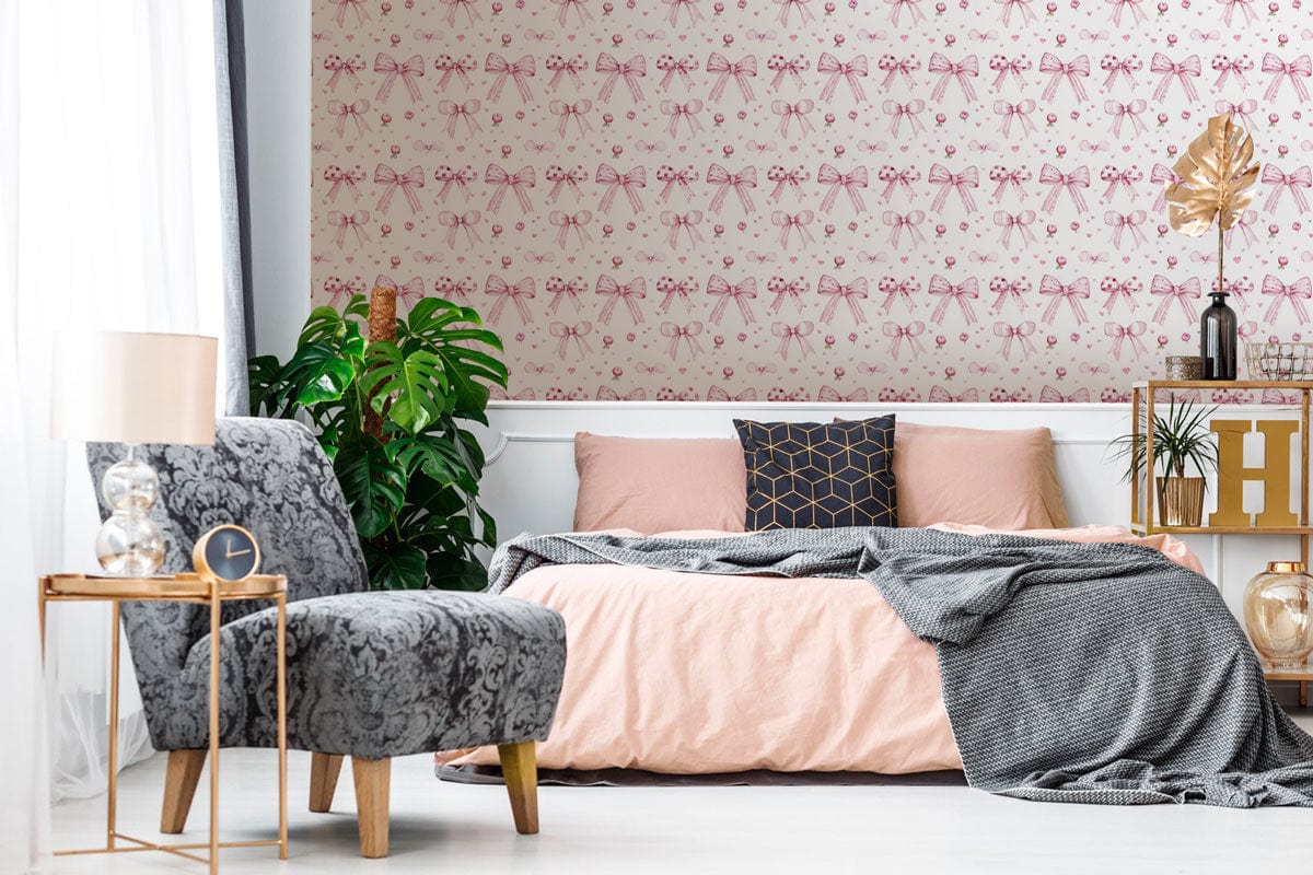 Elegant pink floral wallpaper in bedroom, matching soft furnishings, patterned chair, hardwood flooring.