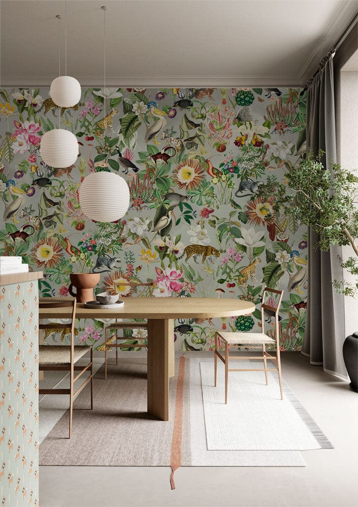 Exotic Jungle Floral Safari Mural Wallpaper in dining room with wooden table, pendant lights, grey curtains.