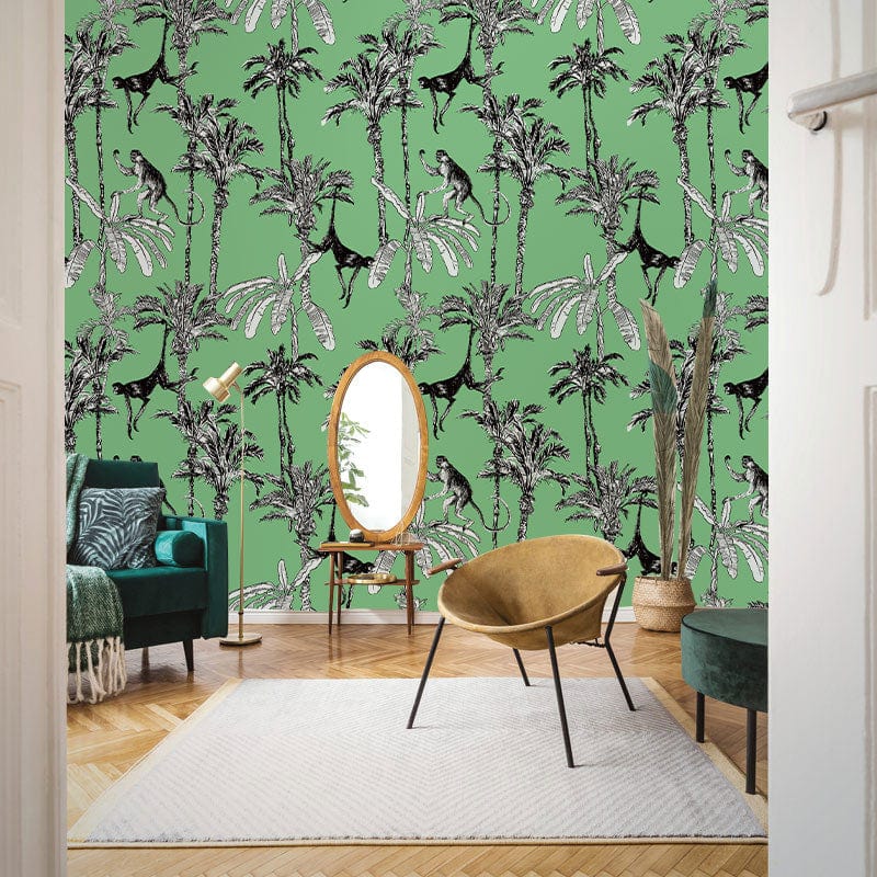Tropical Art Deco wallpaper with monkeys, green palm design; features velvet sofa, parquet flooring, stylish chair.