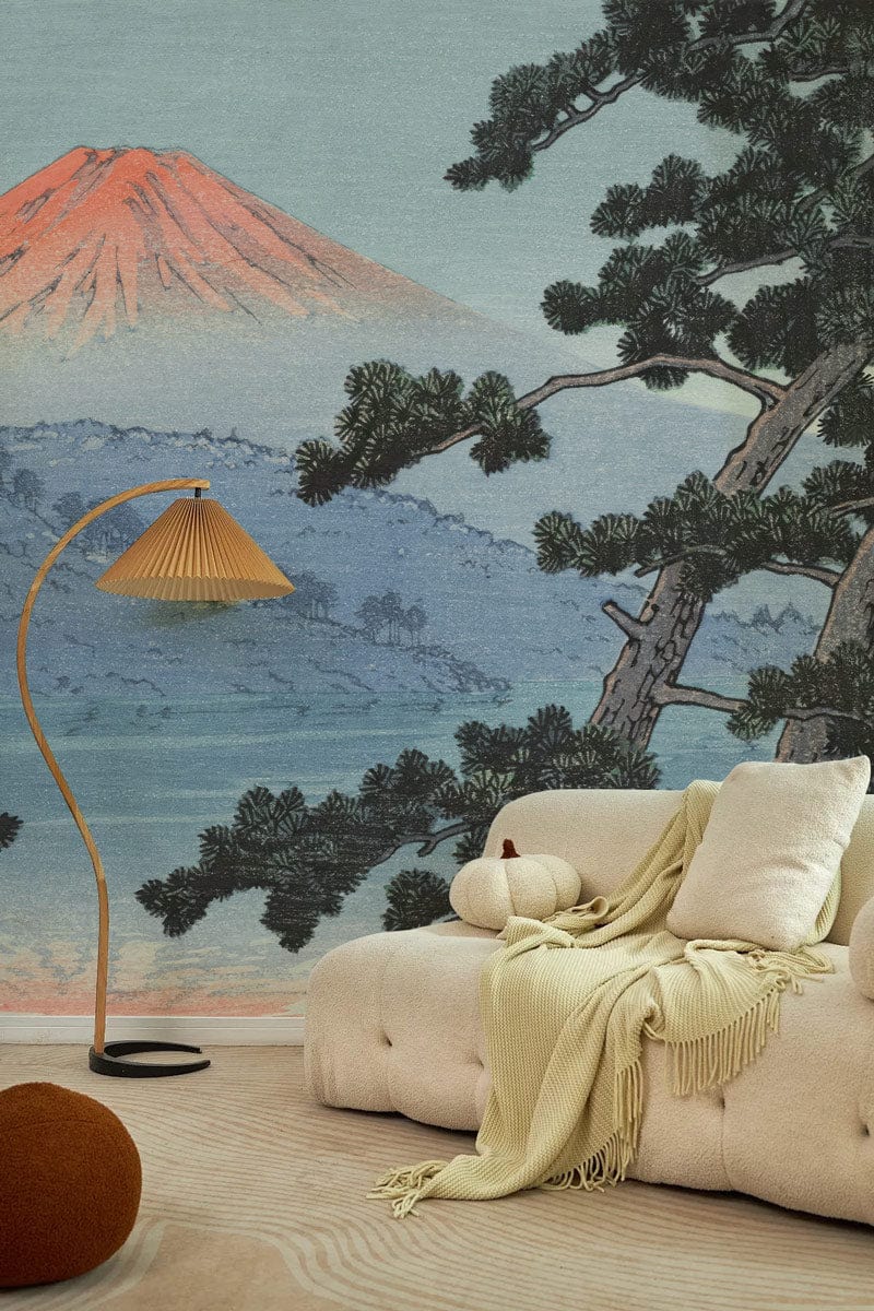 Serene Mountain Landscape Mural Wallpaper in Watercolour Japanese Style, beige sofa, light wood flooring.