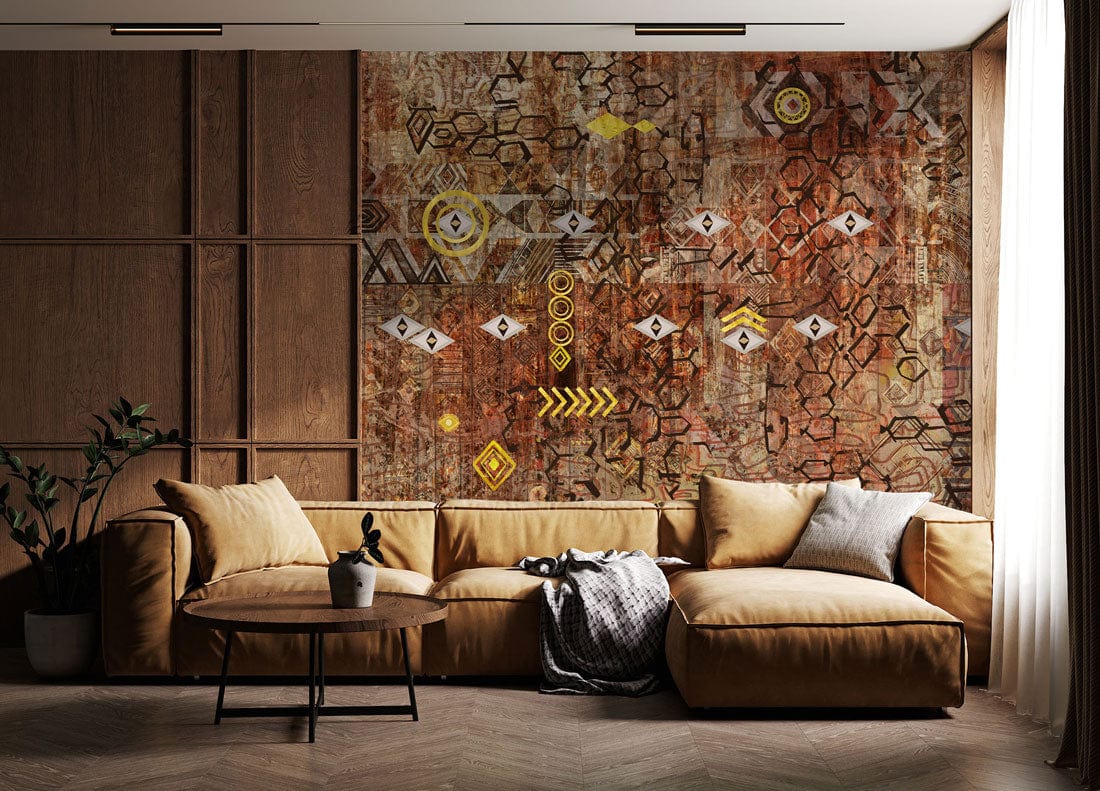 Rustic Geometric Tribal Mural Wallpaper, warm tones; earthy sofa; wooden panel wall; herringbone floor.