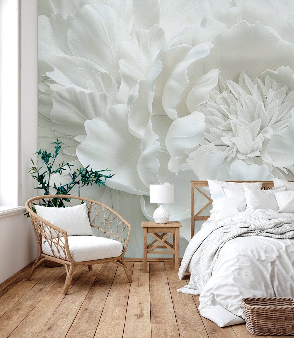 Elegant white floral 3D mural wallpaper with wicker chair, wooden flooring, and bed in bedroom.