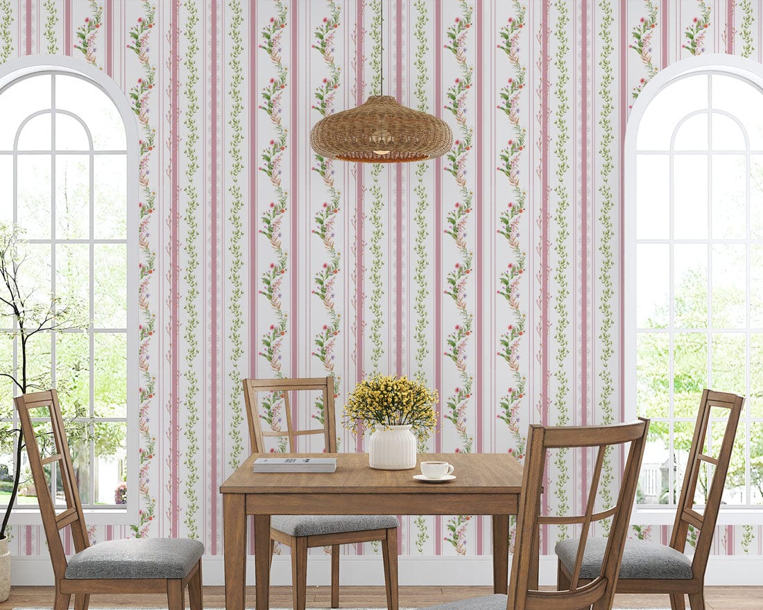 Elegant pastel pink floral striped wallpaper in dining room with wooden furniture and vintage decor elements.