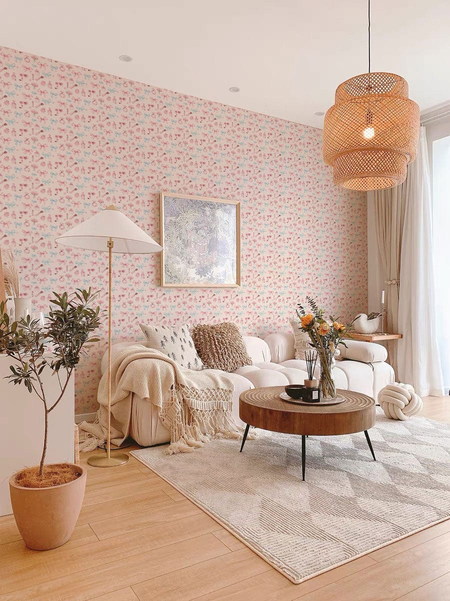 Pastel Floral wallpaper on living room wall, beige sofa, wooden flooring, wicker lampshade, modern decor.