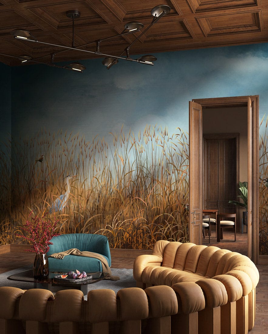 Tranquil Waterscape mural wallpaper with birds, teal armchair, round beige sofa, coffered ceiling.