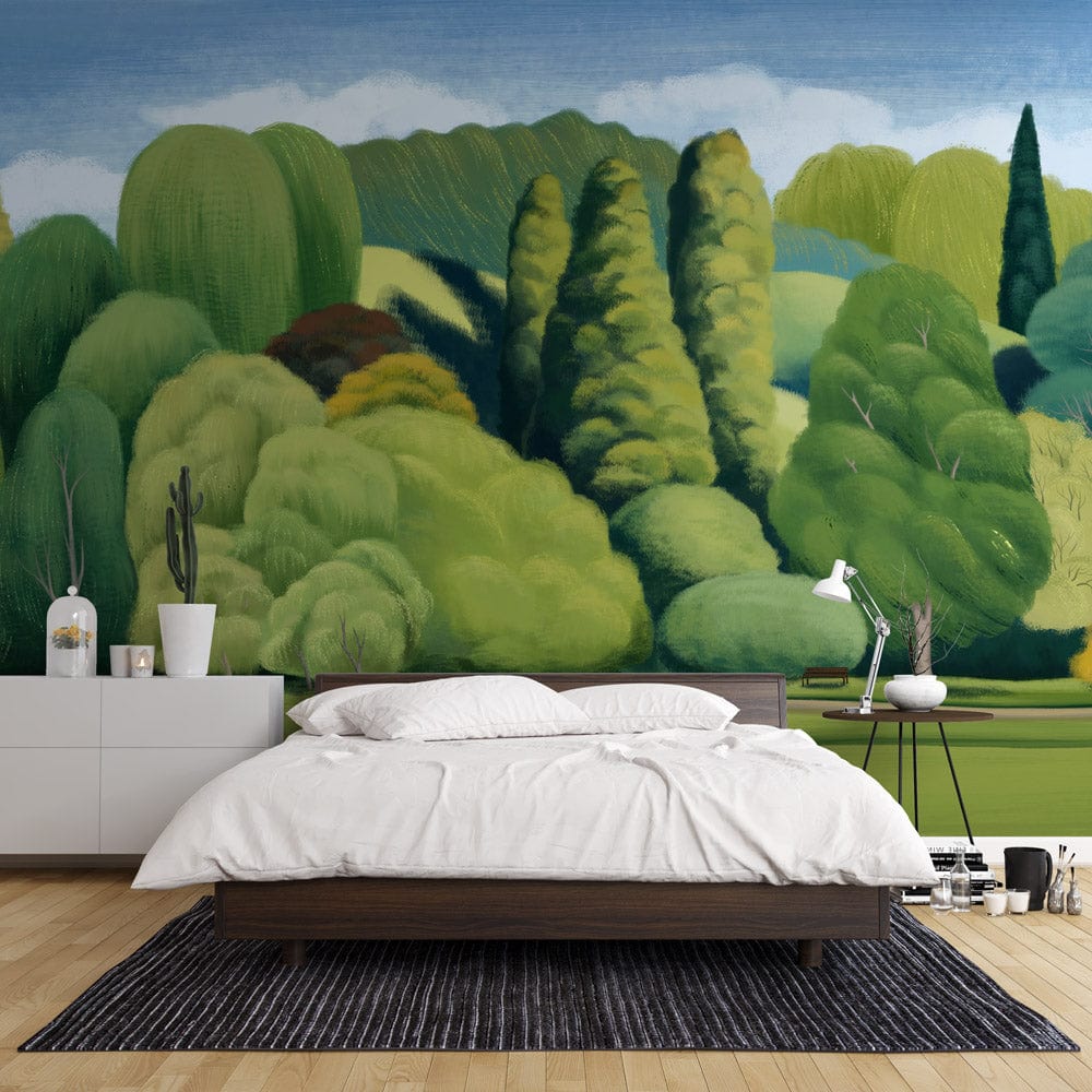 Lush Green Dreamscape Mural Wallpaper in bedroom with modern bed, grey dresser, and wooden flooring.