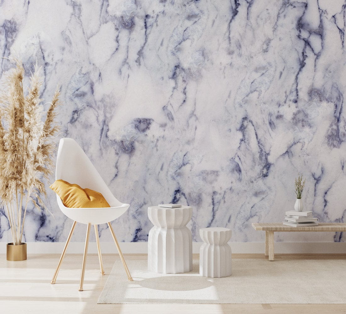 Elegant white and grey marble wallpaper with modern chair, side tables, warm floor in sophisticated interior.