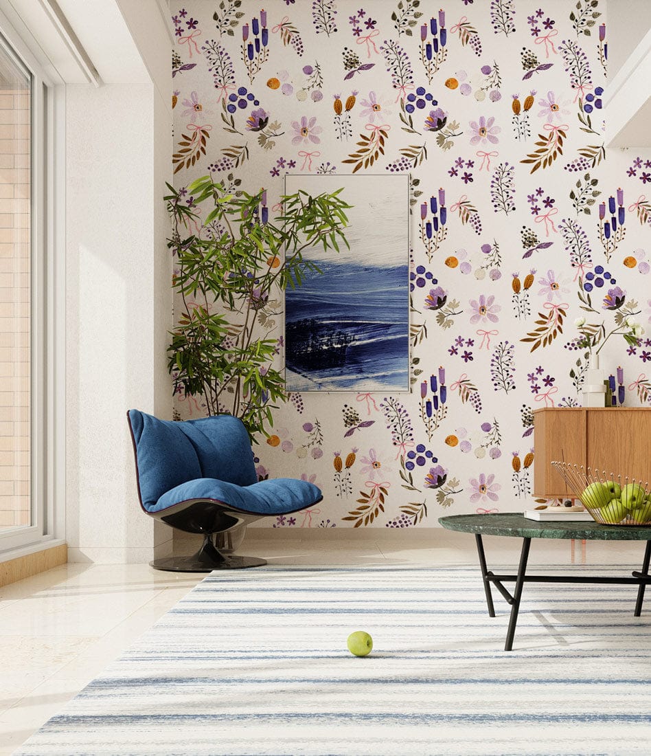 Elegant Wildflower Meadow floral wallpaper in pastel, featuring blue chair, striped rug, modern room decor.