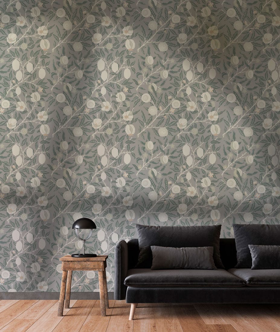 Soft Grey Floral Elegance wallpaper, dark sofa, wooden flooring, side table, vintage botanical pattern.