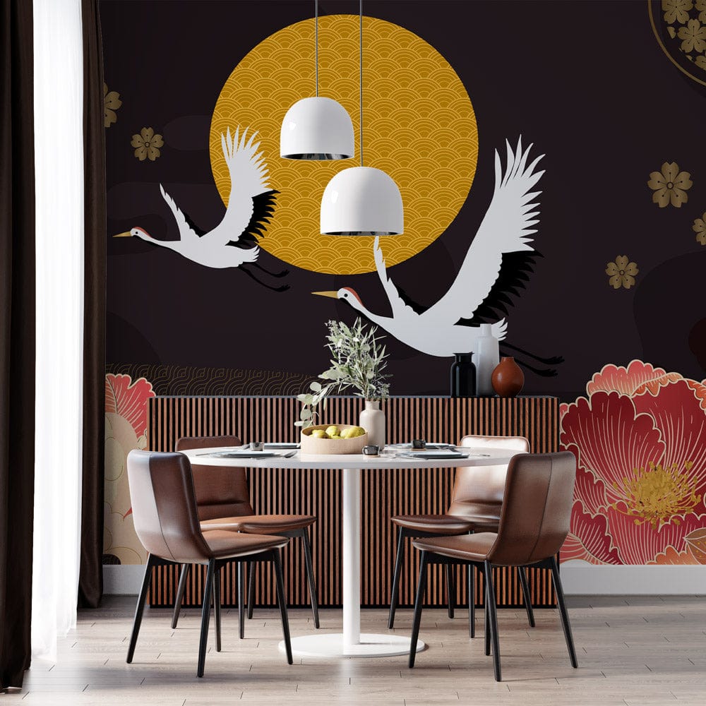 Elegant Japanese cranes and floral wallpaper in black and gold with round table and brown chairs.