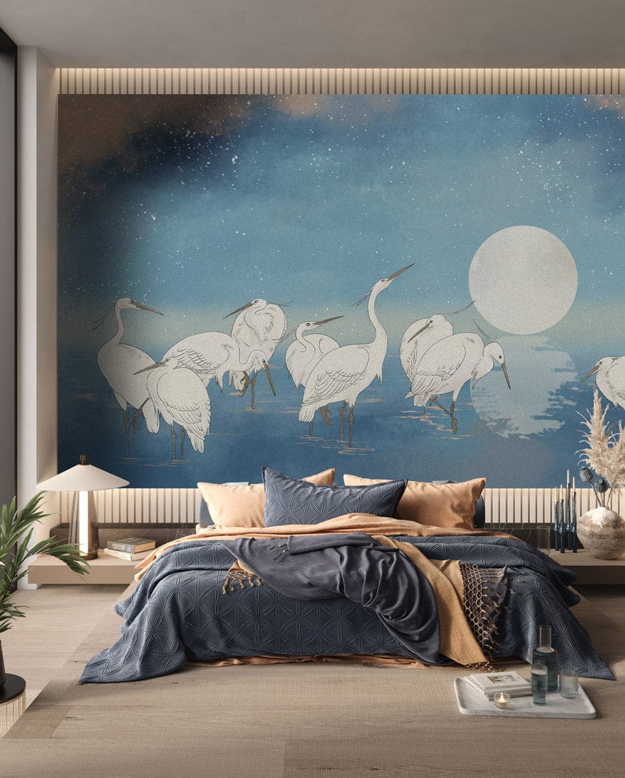 Celestial Heron Sky Mural in bedroom, blue-grey bedding, wooden flooring, tranquil night scene wallpaper.