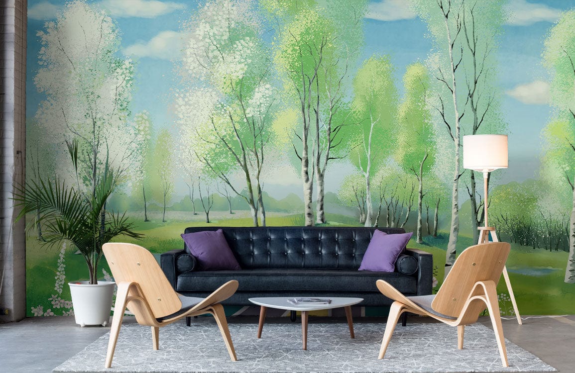 Tranquil birch forest mural wallpaper in pastel greens, black sofa, wooden chairs, grey rug, lamp.