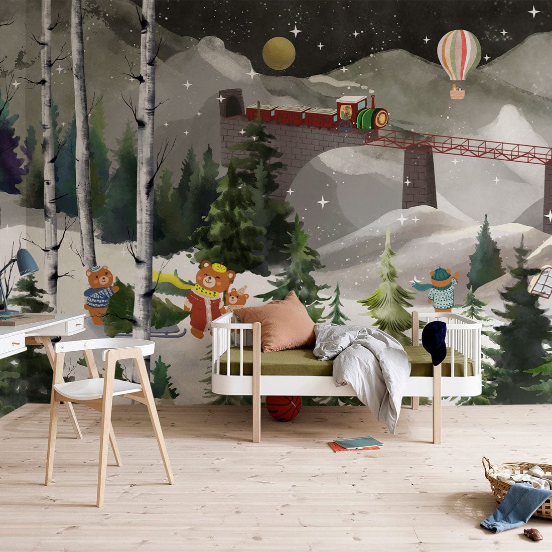 Enchanting winter mural with bears and train, modern wooden chairs, cosy sofa, light wood flooring.