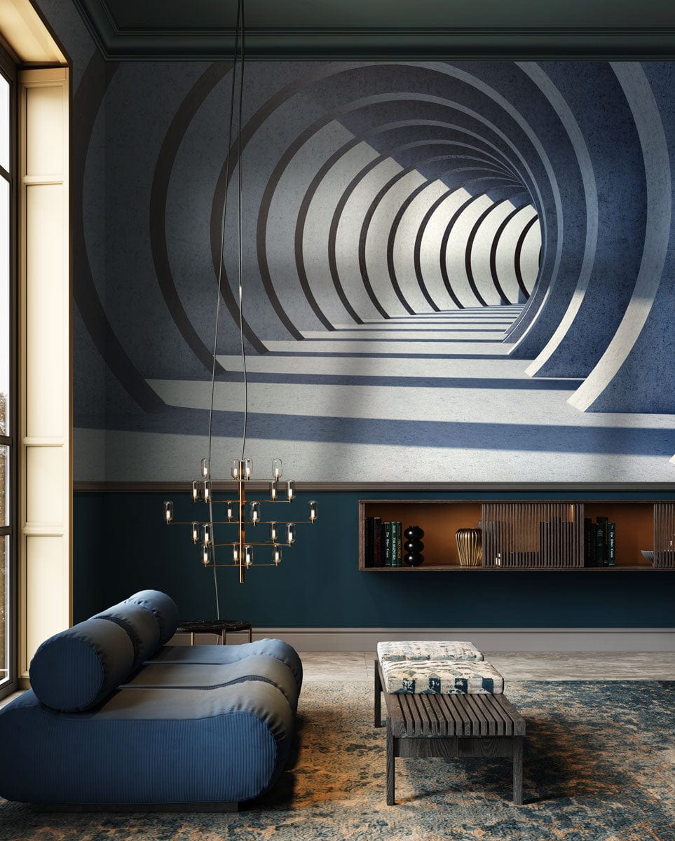Modern grey architectural mural with blue sofa, woven table, parquet flooring, and chandelier in living room.