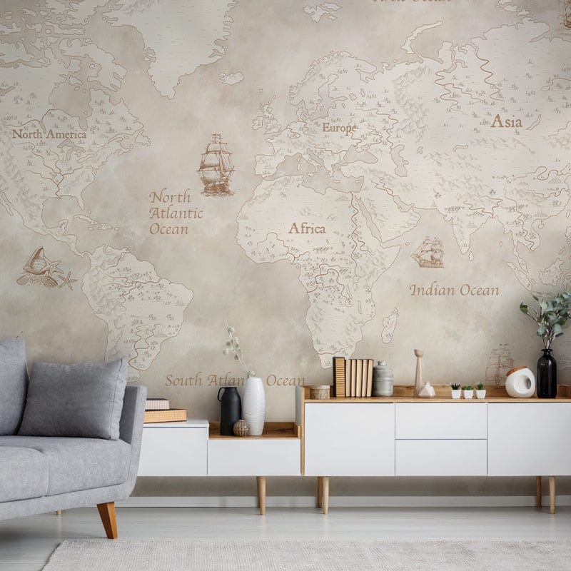 Vintage World Map mural in sepia tones with grey sofa and white sideboard in modern living room.