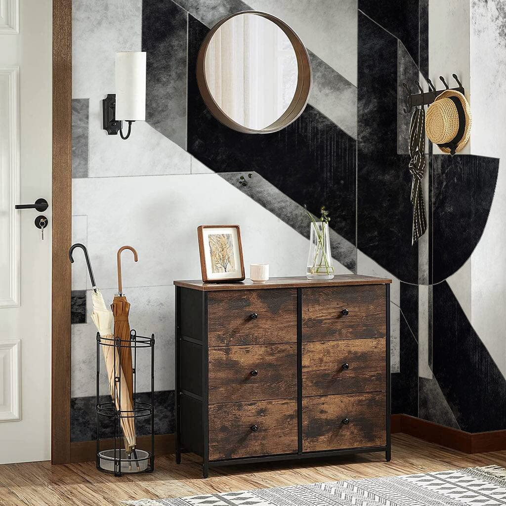 Modern hallway with Monochrome Geometric Art Deco Wallpaper Mural, wooden drawers, round mirror, and umbrella stand.