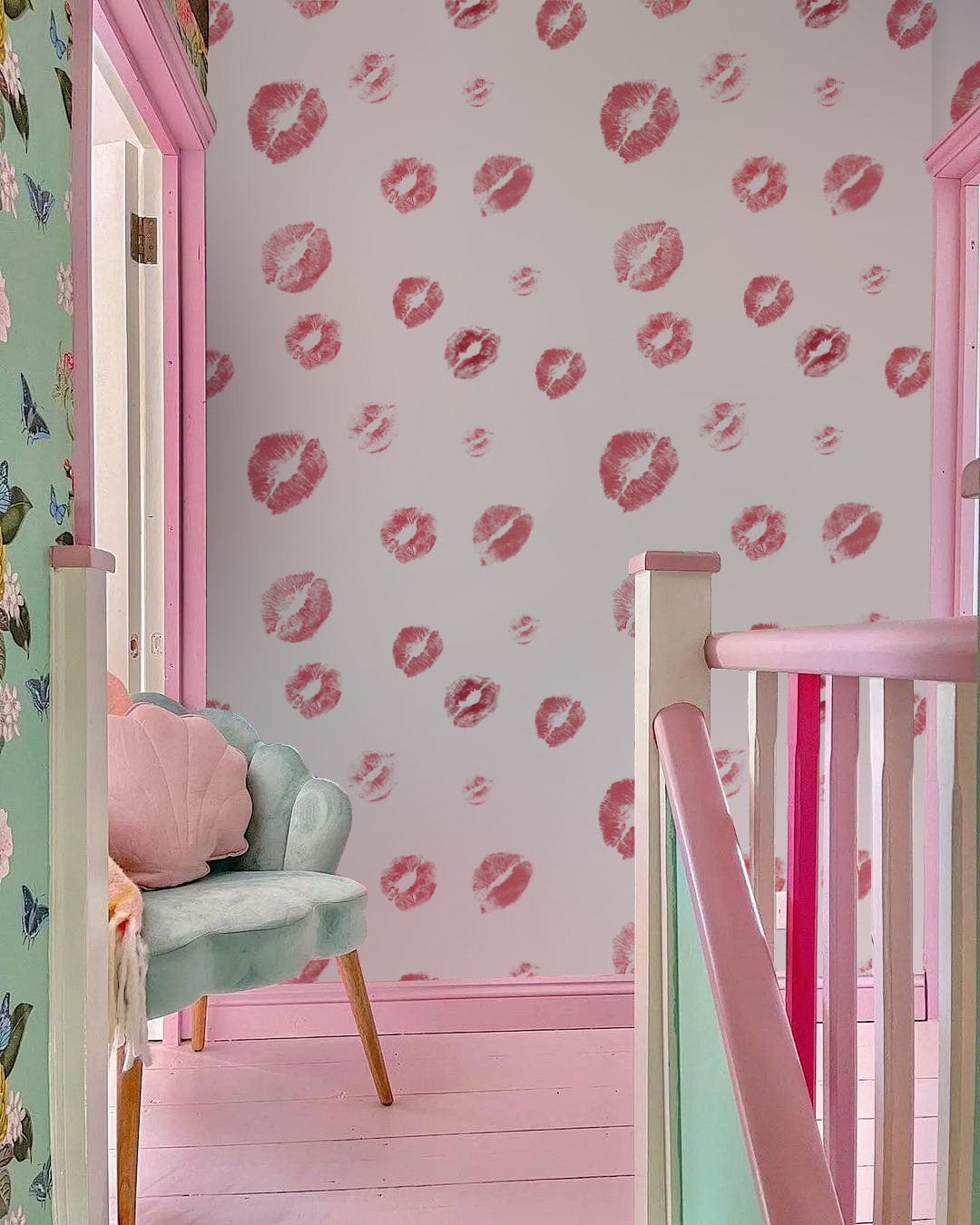 Chic Red Polka Dot Watercolour Wallpaper in stylish room with pastel chair and wooden flooring.