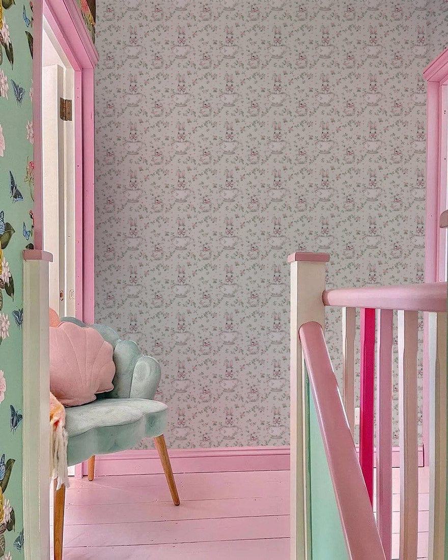 Vintage Pastel Floral wallpaper in hallway with pink trim, mint chair, and pastel flooring.