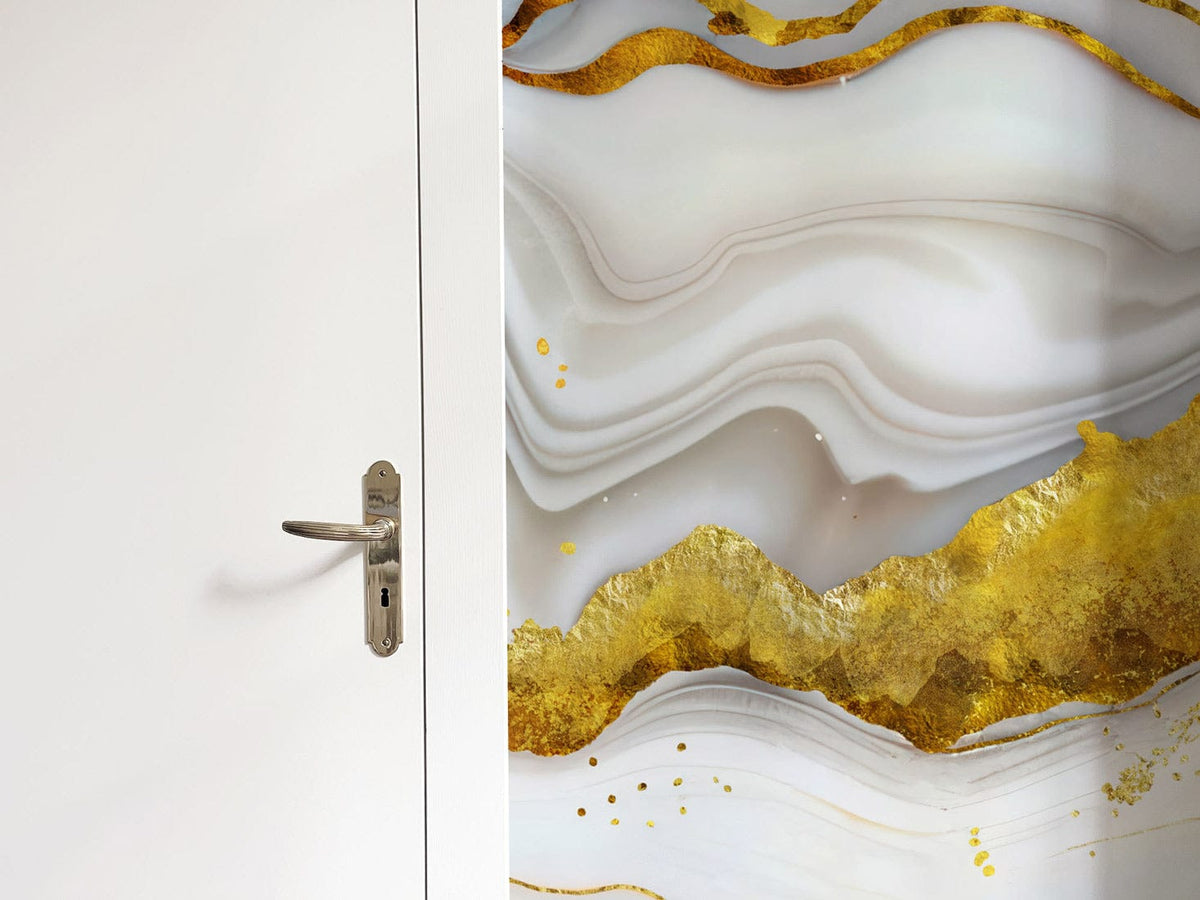 Luxurious marble effect wall mural in gold tones beside white door, abstract art for modern interiors.
