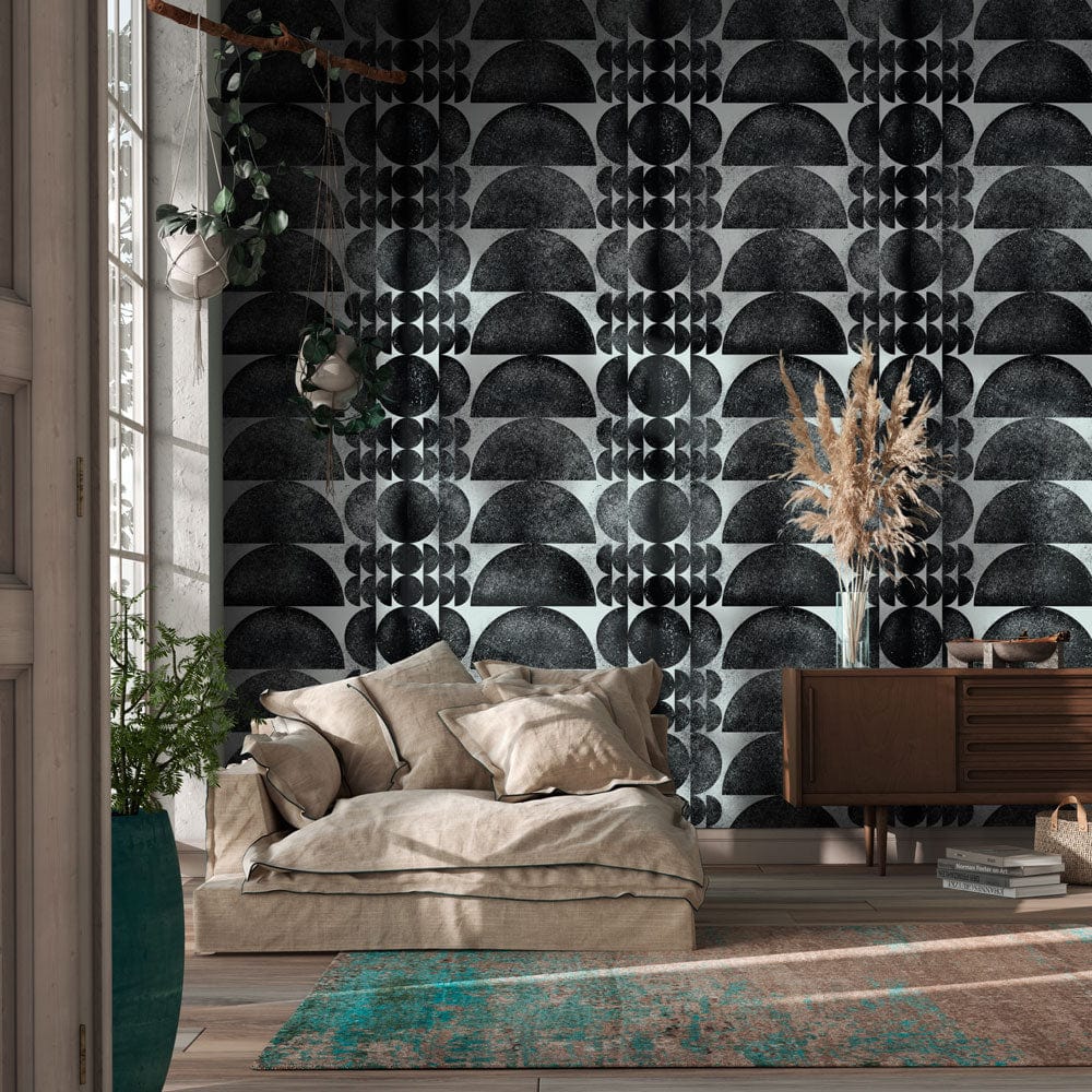 Monochrome geometric wallpaper in living room with beige sofa, wooden console, turquoise rug, stylish decor.