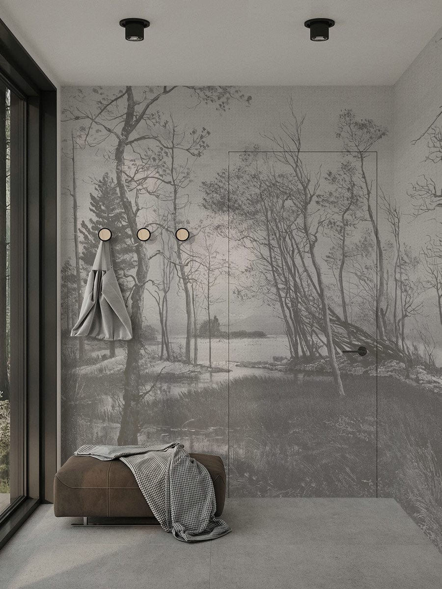 Monochrome forest mural wallpaper in modern room with grey flooring, brown ottoman, and wall hooks.